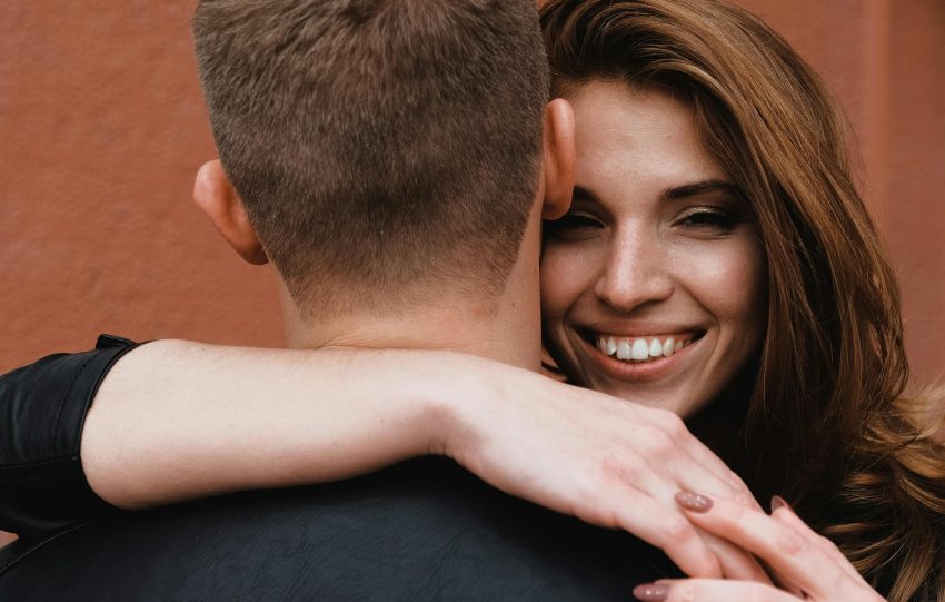 A close-up of a couple embracing, highlighting affection and happiness.